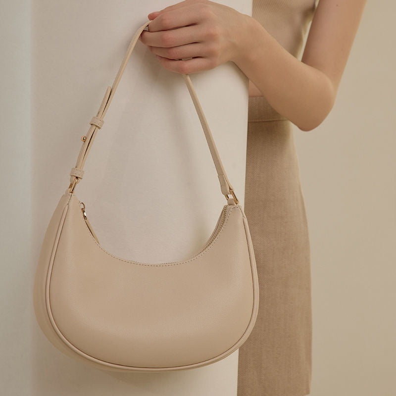 Sac à bandoulière minimaliste en forme de croissant